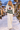 Look 8: female model, snowy village street