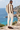 Male coastal back-view look with cream trousers