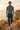 Male coastal editorial with blue polo and constellation joggers