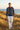 Male model in a golden coastal dunes editorial