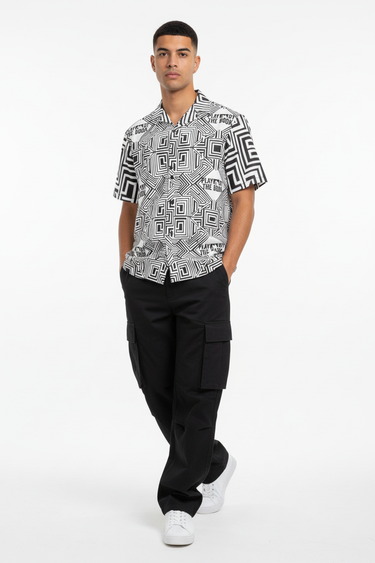 Male model in black cargo pants and white sneakers