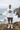 Male model in white Oregon tee with charcoal shorts