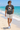 Male model wearing the asphalt vampire skate tee on a sunny beach