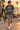 Male model wearing the charcoal tee in a coastal surf town