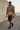 Male model wearing the hoodie with charcoal cargo shorts