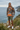 Male model wearing the hoodie with olive shorts