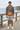 Male model wearing the hoodie with stone shorts