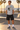 Male model wearing the sport-grey tee beside a beachfront skate bowl