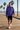 Male model wearing the tie-dye sweatshirt with black boardshorts