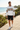 Male model wearing the white graphic hoodie with black shorts