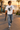 Male model wearing the white skeleton skate tee in a surf town