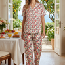 Matching floral pajama set in a breakfast nook