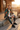Matching jacket and track pants in a seated alpine lodge look