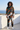 Matching jacket and track pants on a seaside rooftop