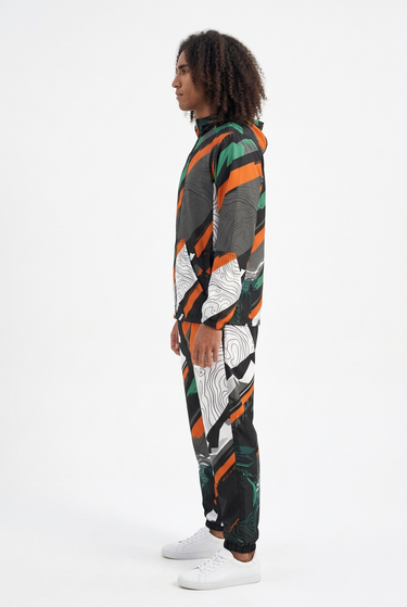 Matching jacket and track pants, side view on white