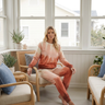 Matching sunset crewneck and joggers in coastal sunroom