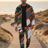 Matching track pants with the jacket worn open on a beach boardwalk