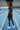 Men’s leggings back view at an indoor track