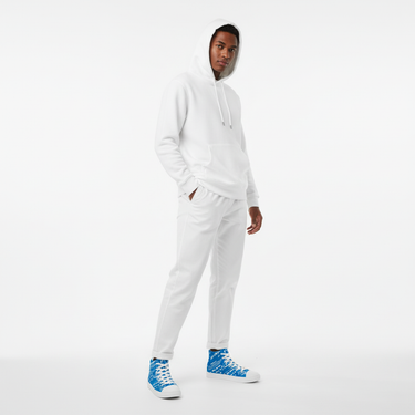 Model all-white outfit with blue shoes