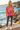 Model in tie-dye hoodie with charcoal leggings