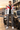 Model standing facing forward beside the sports car