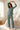 Model stretching in the matching Sunset Palms pajama set