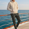 Mountain-print joggers styled with an oatmeal hoodie