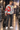 Music-print windbreaker backstage at a concert