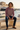 New male model seated at the marina
