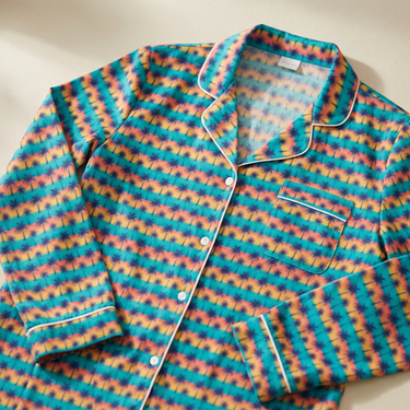 Palm-print pajama top collar close-up