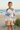 Pastel palm rash guard editorial look