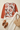 Pear sweater flat lay with ivory linen trousers
