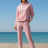 Pink patterned hoodie with matching joggers by the sea