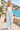 Promenade look with a white tank and sneakers