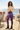 Purple leggings with cream sweater coastal café editorial