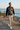Quarter-zip coastal editorial with gray distressed jeans