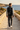 Quarter-zip seaside back-view editorial
