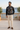 Quarter-zip styled with cream chinos on a Mediterranean terrace