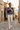 Quarter-zip sweater in a Mediterranean village