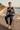Quarter-zip sweater on a coastal promenade