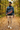 Quarter-zip with sand corduroys on a woodland path