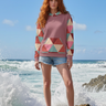 Red-haired model hoodie editorial with denim shorts