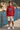 Red hoodie with cream shorts