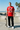 Red ODDSON tee at an oceanfront skate park