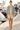 Reference model wearing floral bomber with tailored shorts