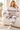 Relaxed matching-set look on an ivory sofa