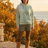 Sage hoodie with winter shorts and tights
