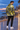 Seaside promenade editorial showing the jacket back