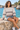 Seated seaside look with denim shorts