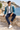Seated seaside look with navy trousers